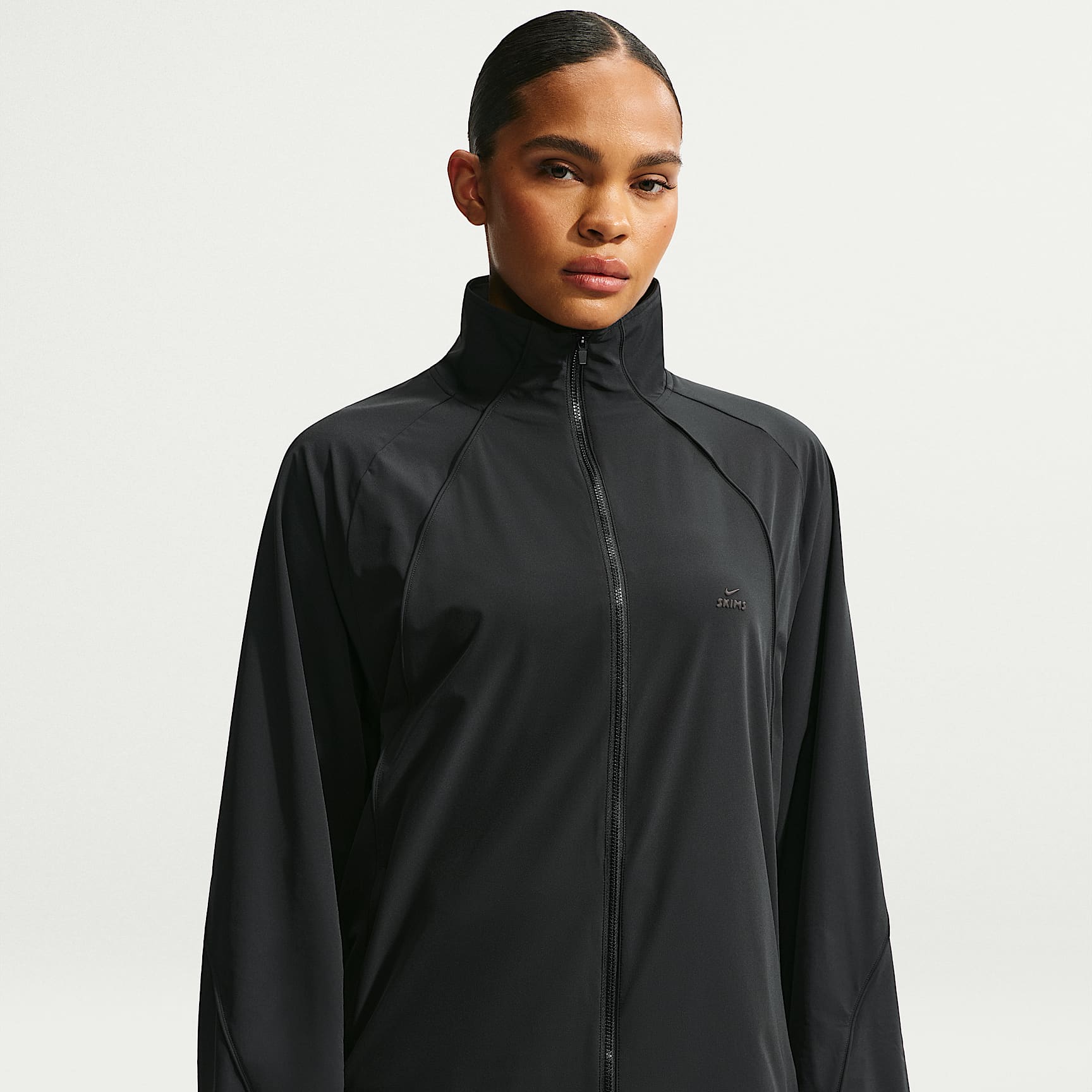 NikeSKIMS Stretch Nylon Women's Oversized Jacket. Nike SE